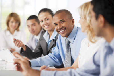 Large group of business people sitting in a row and communicating.  The focus is on African-American looking at the camera. 

[url=http://www.istockphoto.com/search/lightbox/9786622][img]http://dl.dropbox.com/u/40117171/business.jpg[/img][/url]

[url=http://www.istockphoto.com/search/lightbox/9786738][img]http://dl.dropbox.com/u/40117171/group.jpg[/img][/url]