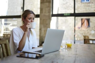 woman with coffee and laptop_GS